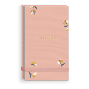 Pink fabric notepad with ditsy designs, perfect for stylish note-taking.