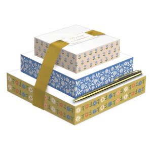 Mustard floral tower of notes, ideal for jotting down ideas and reminders.
